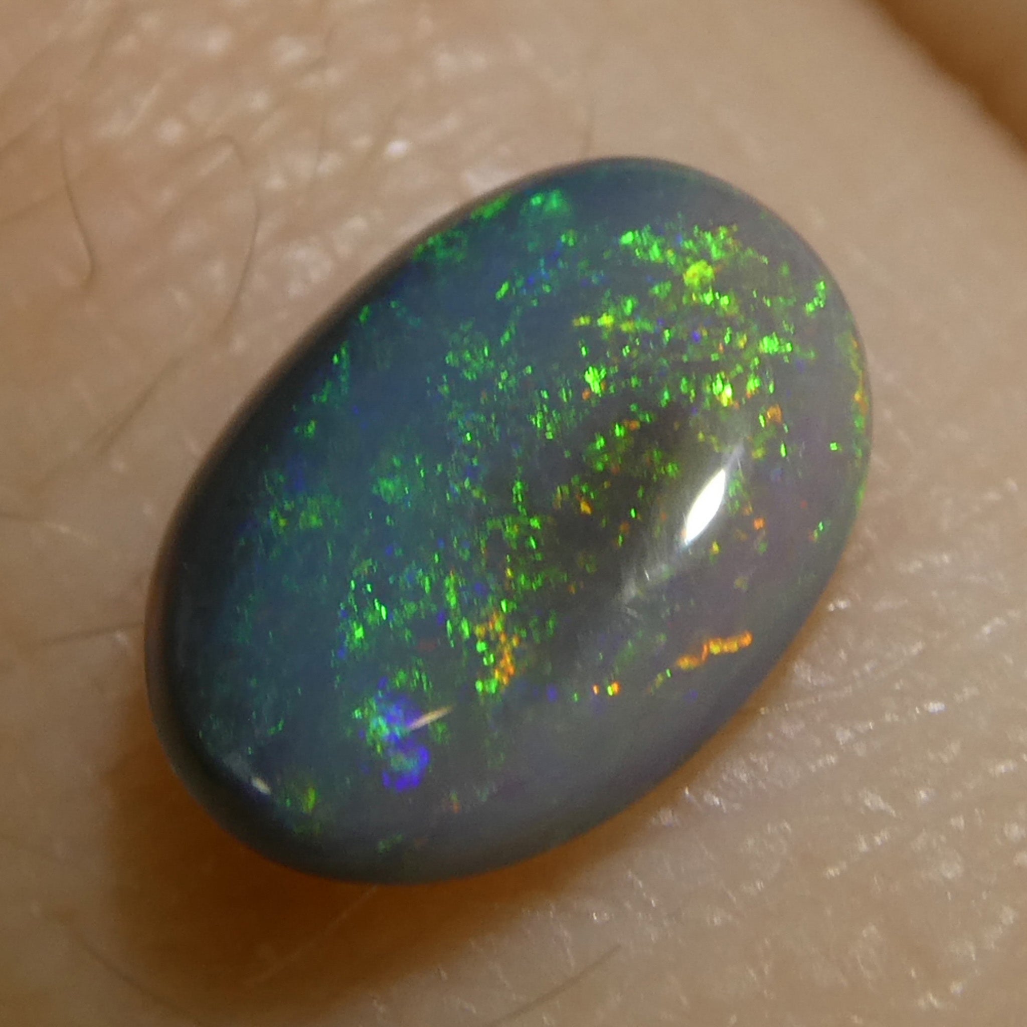 0.59ct Gray Oval Cabochon Opal with Play of Color from Australia, premium gemstone by SkyJems Canadian gem experts