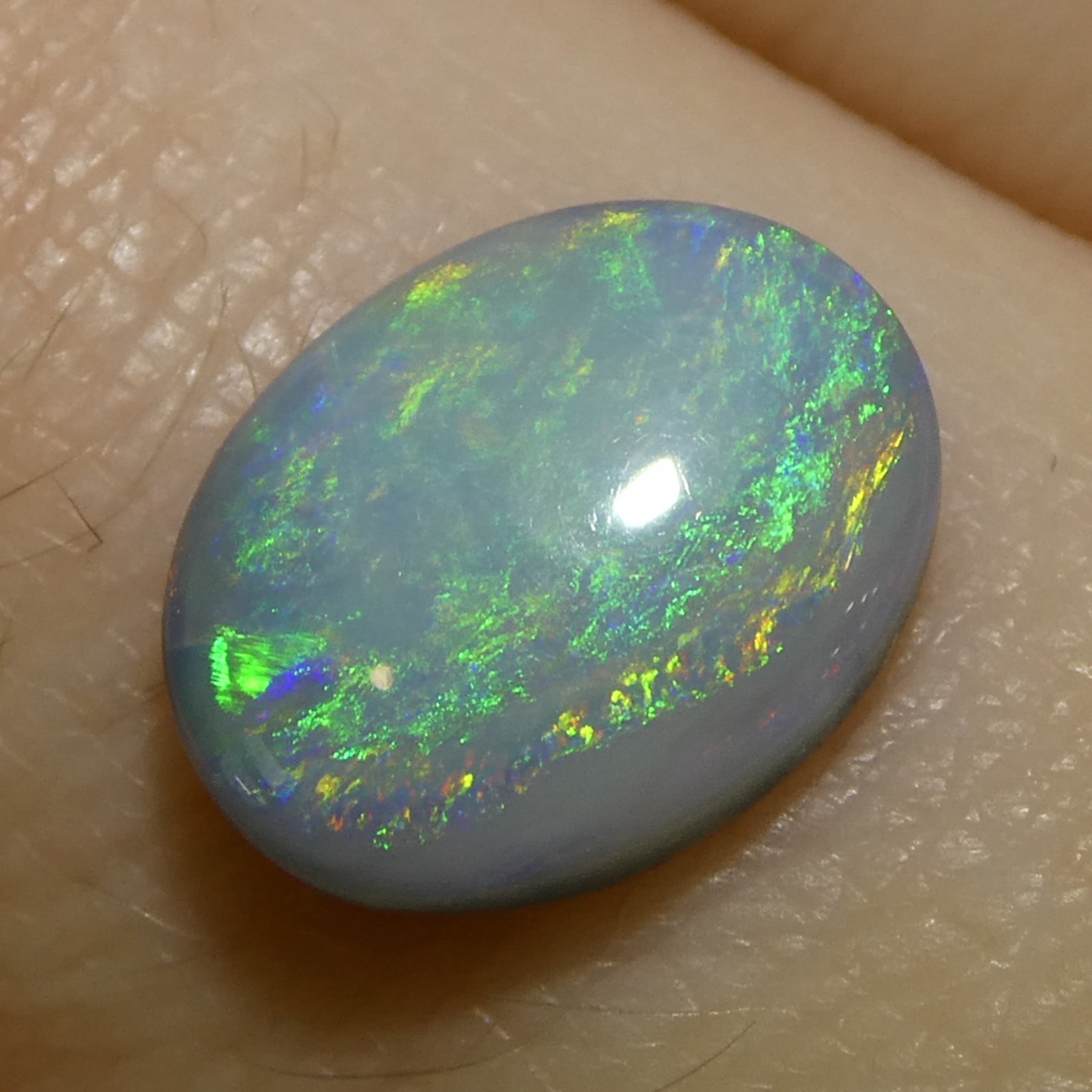 1.06ct Gray Oval Cabochon Opal from Australia with Play of Color, premium gemstone by SkyJems Canadian gem experts