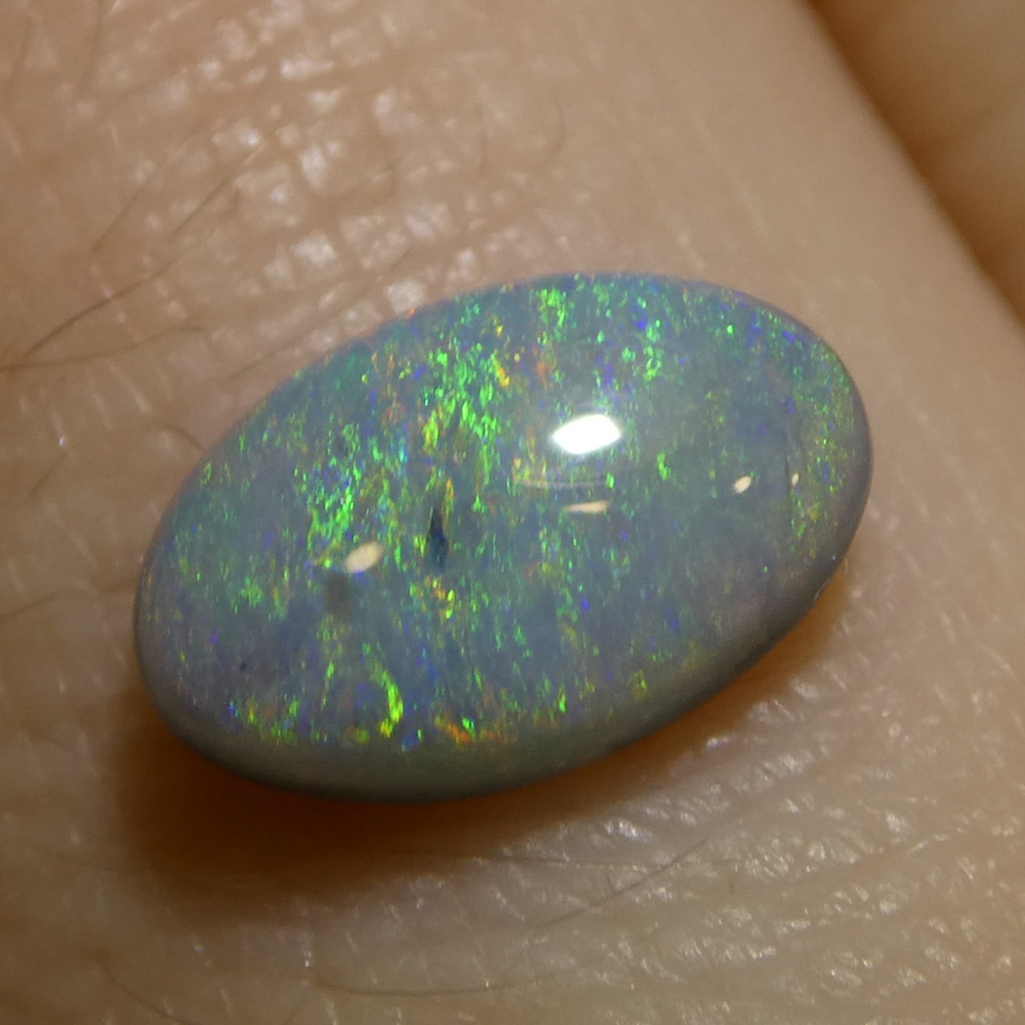0.71ct Gray Oval Cabochon Opal from Australia with Play of Color, premium gemstone by SkyJems Canadian gem experts