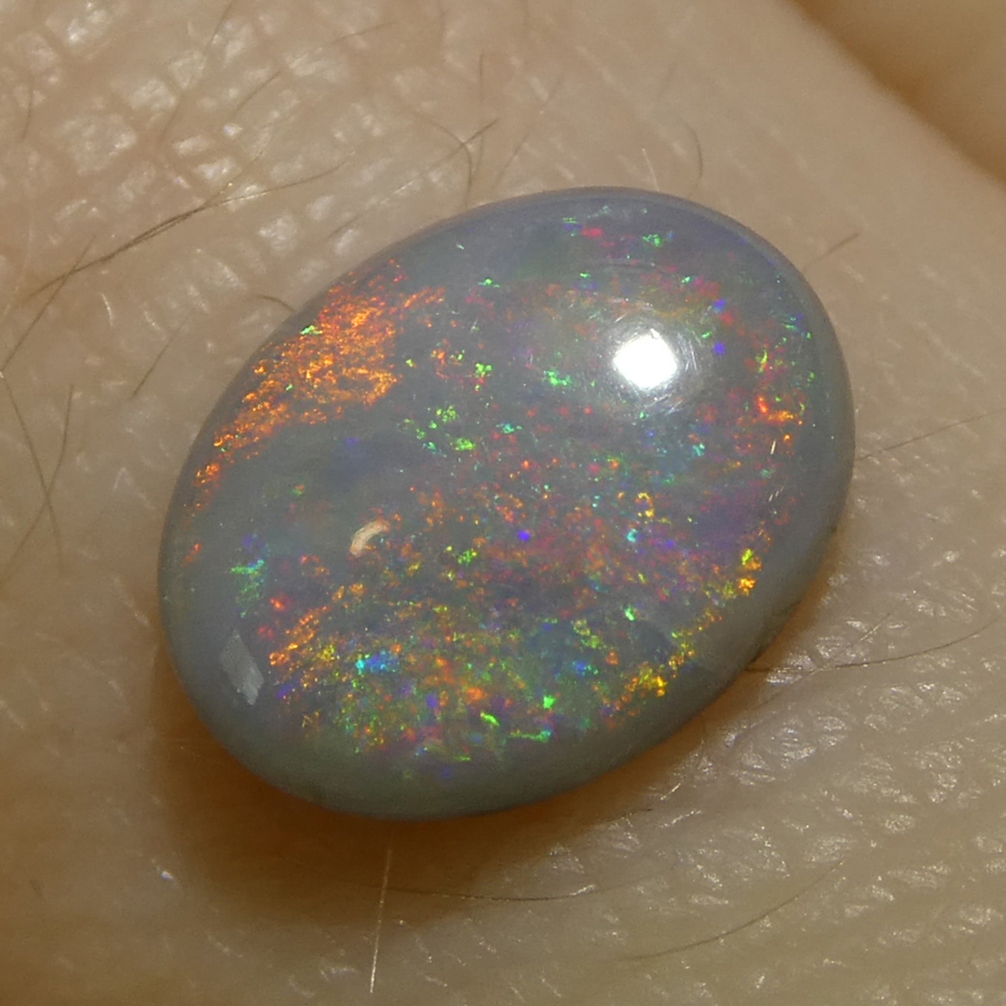 0.73ct Gray Oval Cabochon Opal from Australia with Play of Color, premium gemstone by SkyJems Canadian gem experts