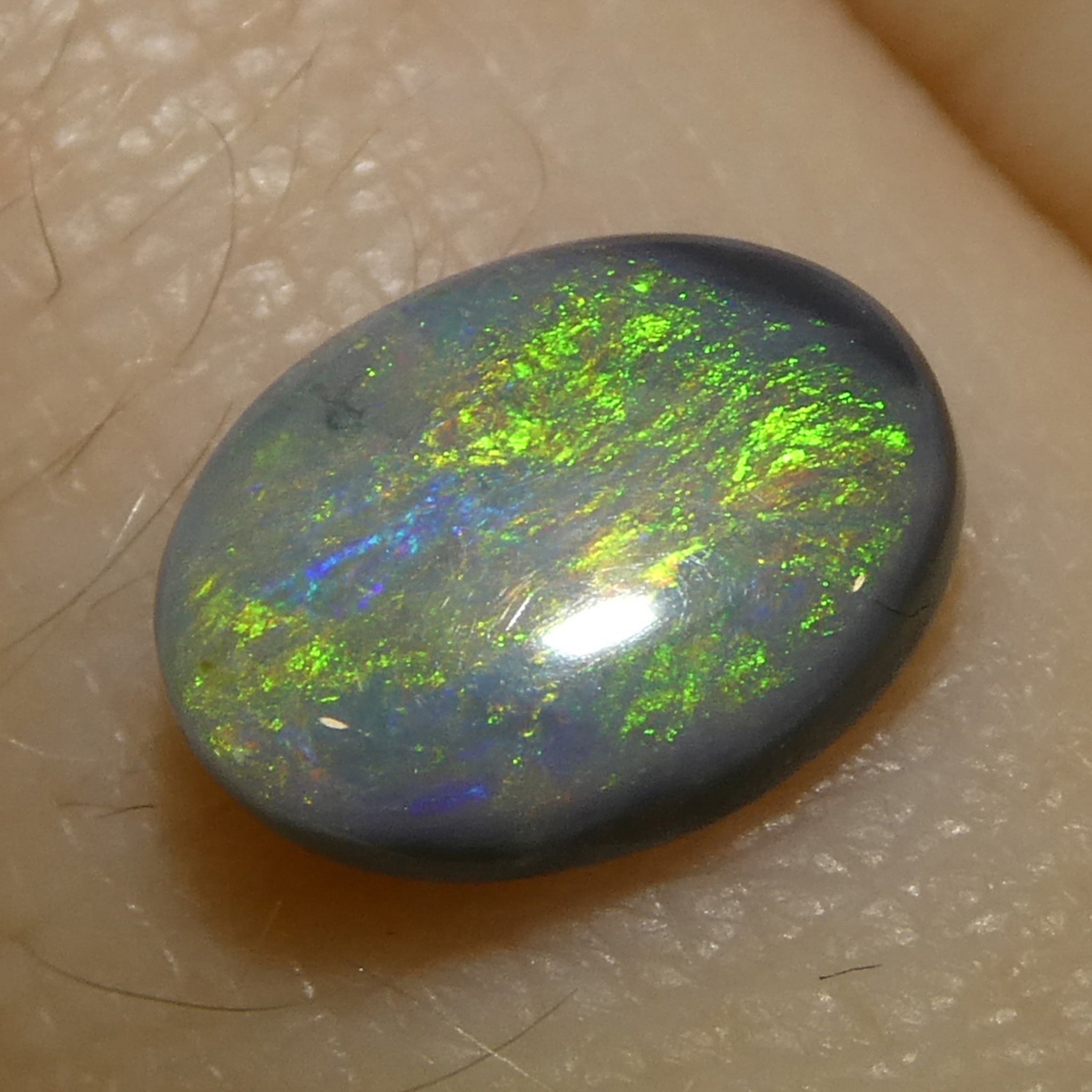 0.64ct Gray Oval Cabochon Opal with Play of Color from Australia, premium gemstone by SkyJems Canadian gem experts