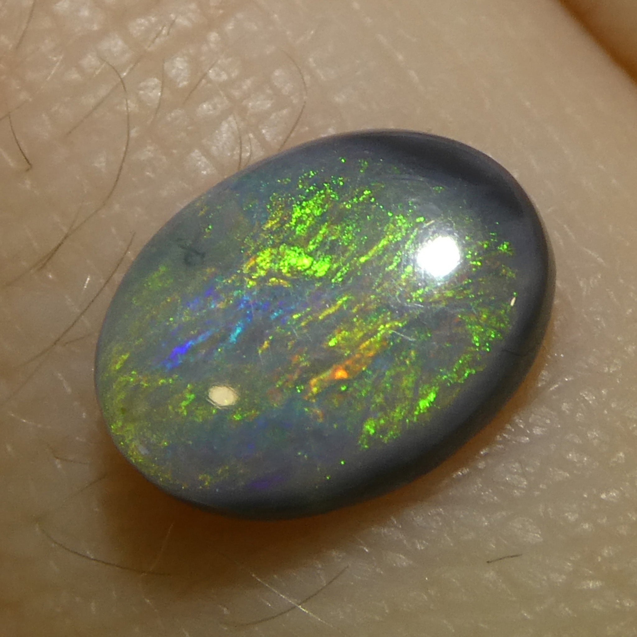 0.64ct Gray Oval Cabochon Opal with Play of Color from Australia, premium gemstone by SkyJems Canadian gem specialists