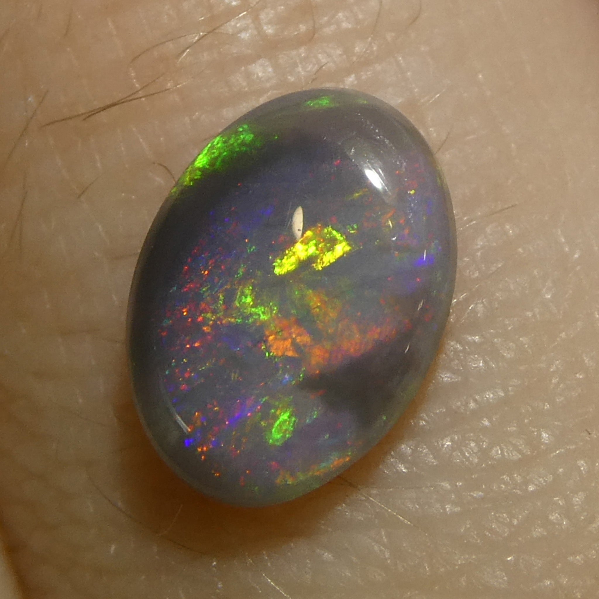 0.63ct Gray Oval Cabochon Opal with Play of Color from Australia, premium gemstone by SkyJems Canadian gem experts