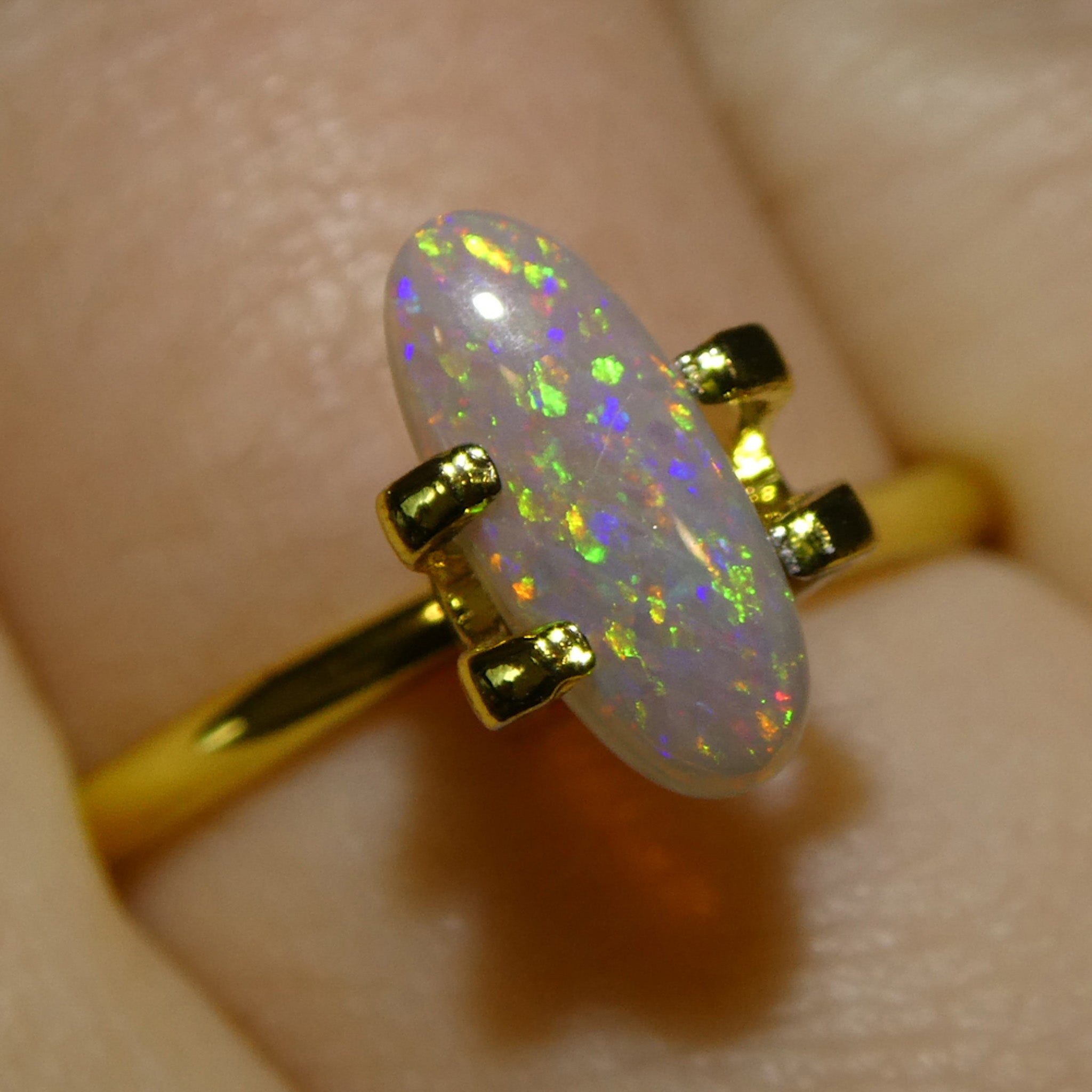 0.62ct White Opal Cabochon with Play of Color from Australia, premium gemstone by SkyJems Canadian gem specialists
