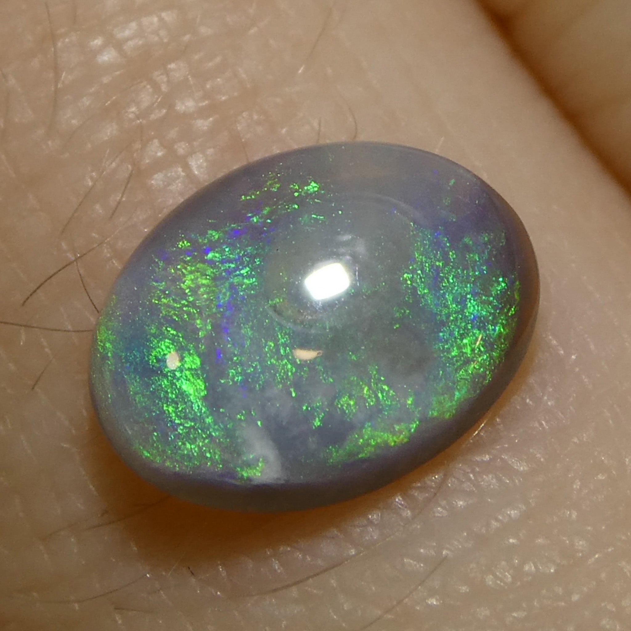 0.58ct Gray Oval Cabochon Opal from Australia with Play of Color, premium gemstone by SkyJems Canadian gem experts