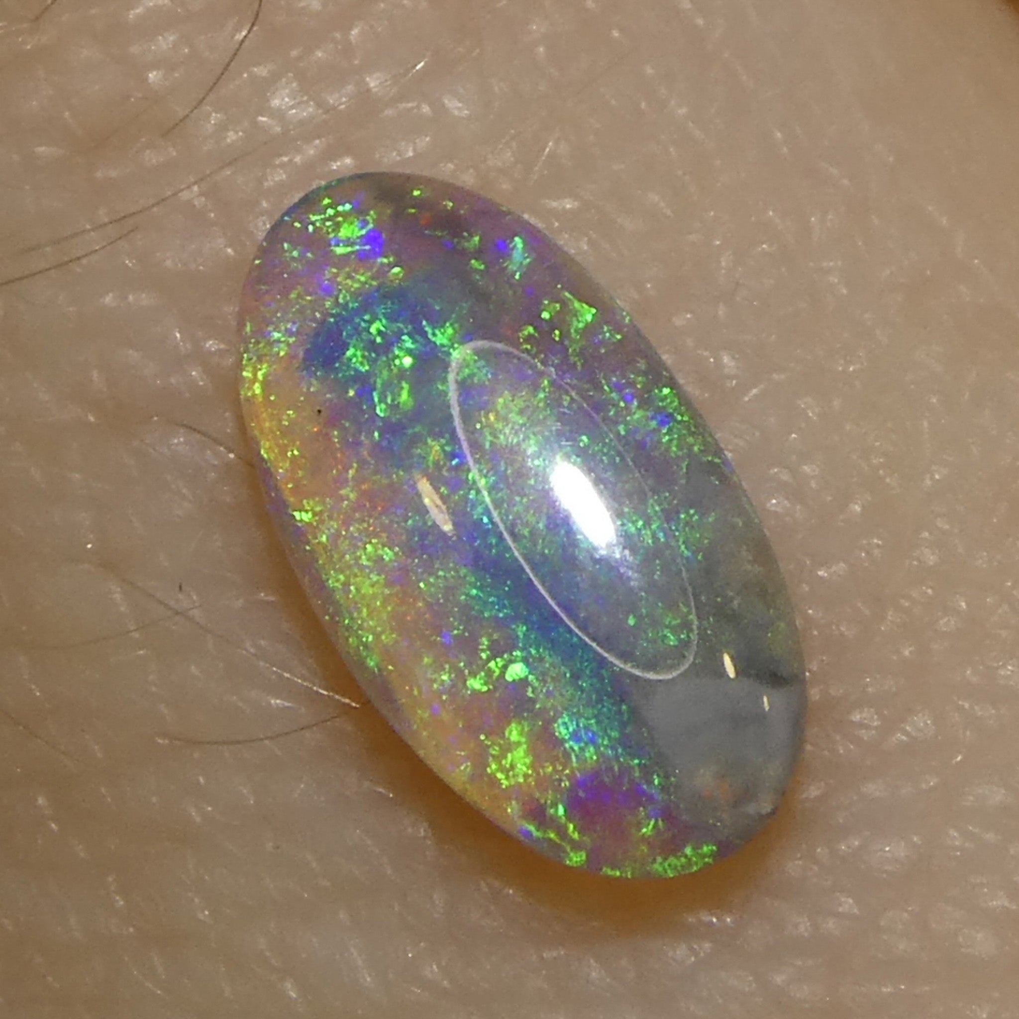 0.29ct White Opal Cabochon with Play of Color from Australia, premium gemstone by SkyJems Canadian gem specialists