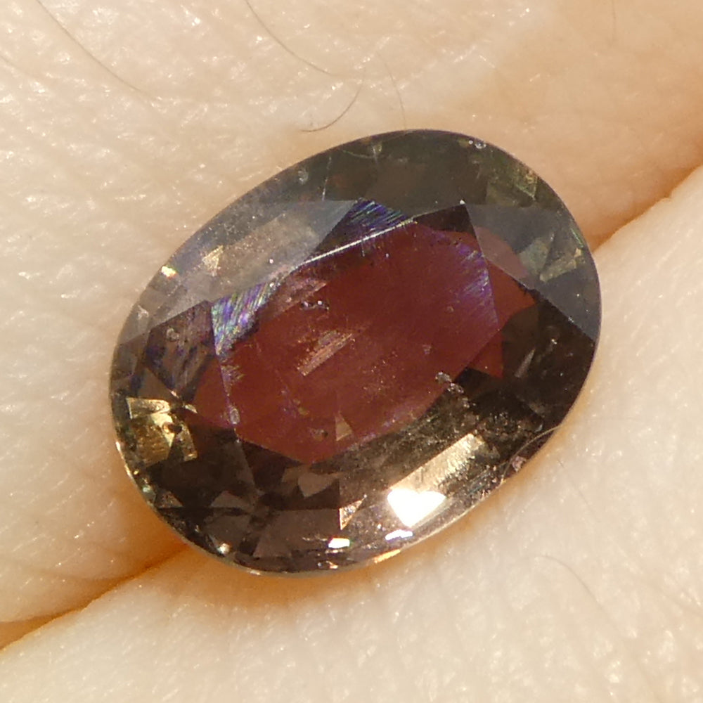 1.57ct Tanzanian Brownish Pink Sapphire Oval Step Cut, premium heated single stone by SkyJems Canadian gemstone experts