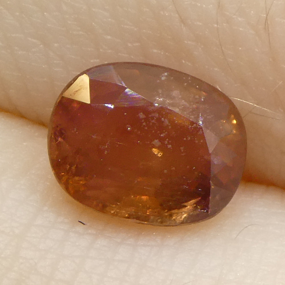 1.67ct Tanzanian Orange Cushion Sapphire, vibrant single stone from SkyJems' premium colored gemstone collection