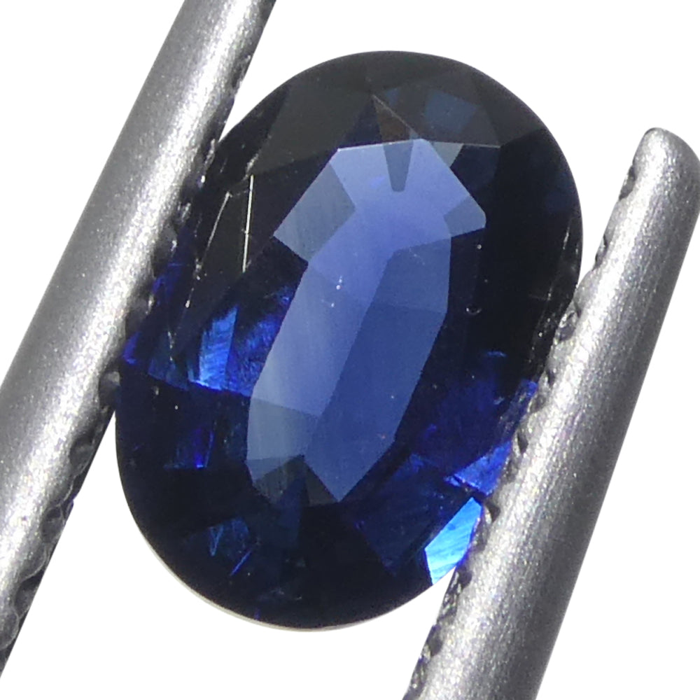0.73ct Oval Blue Sapphire from Madagascar, very slightly purplish, Step Cut gemstone by SkyJems Canadian gem experts