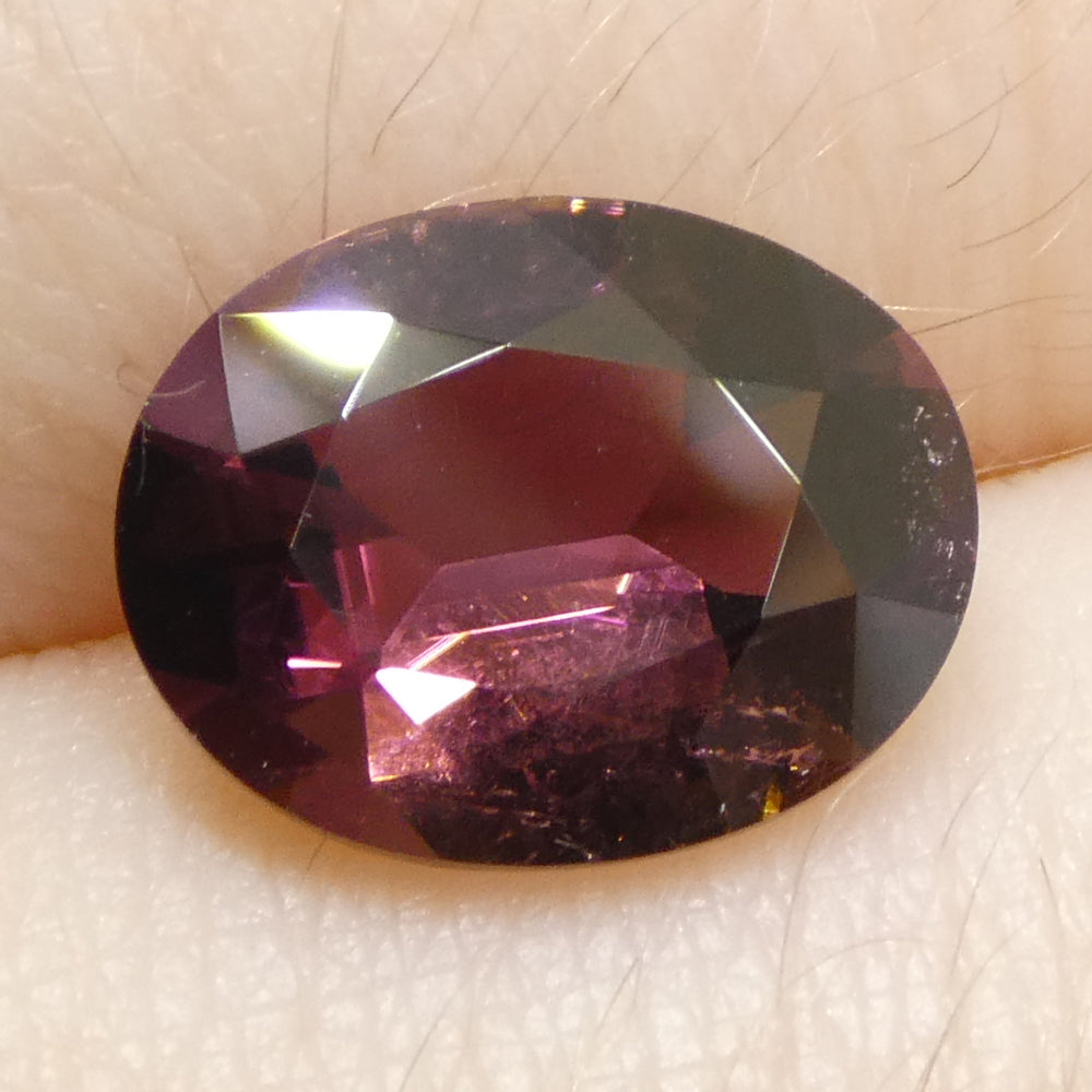 2.1ct Oval Pink Tourmaline from Brazil, slightly orangy hue, precision step cut by SkyJems Canadian gemstone experts