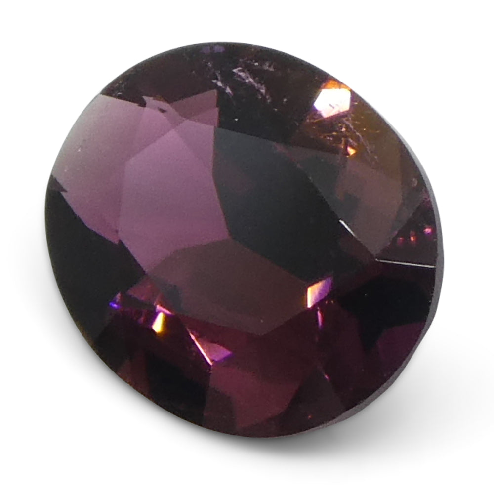 2.1ct Oval Pink Tourmaline from Brazil, slightly orangy hue, precision step cut by SkyJems Canadian gemstone experts
