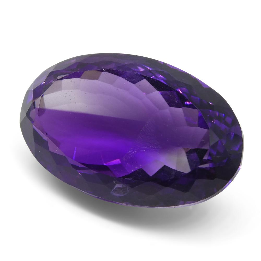 Large 21.55 ct purple Brazilian Amethyst oval gemstone from SkyJems, premium unheated Modified Brilliant cut
