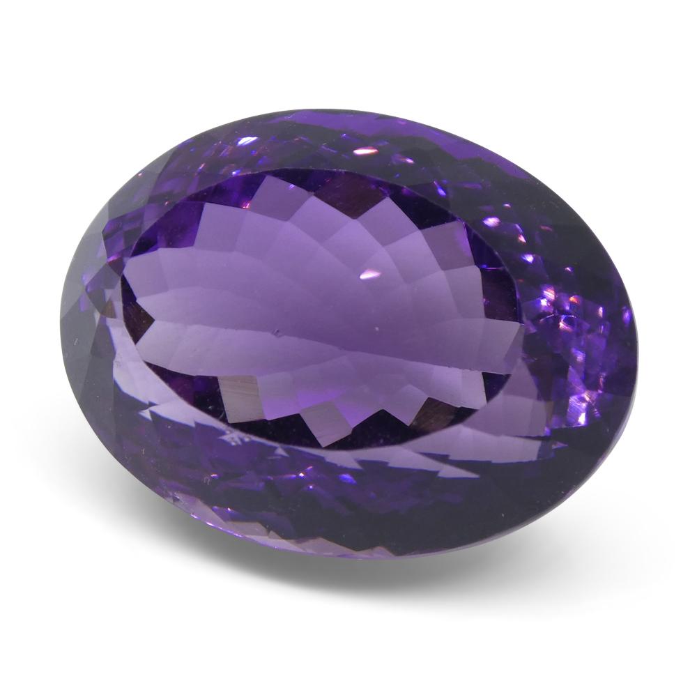 Large 26.08 ct purple Brazilian Amethyst oval gemstone from SkyJems, showcasing vibrant Modified Brilliant cut and natural un
