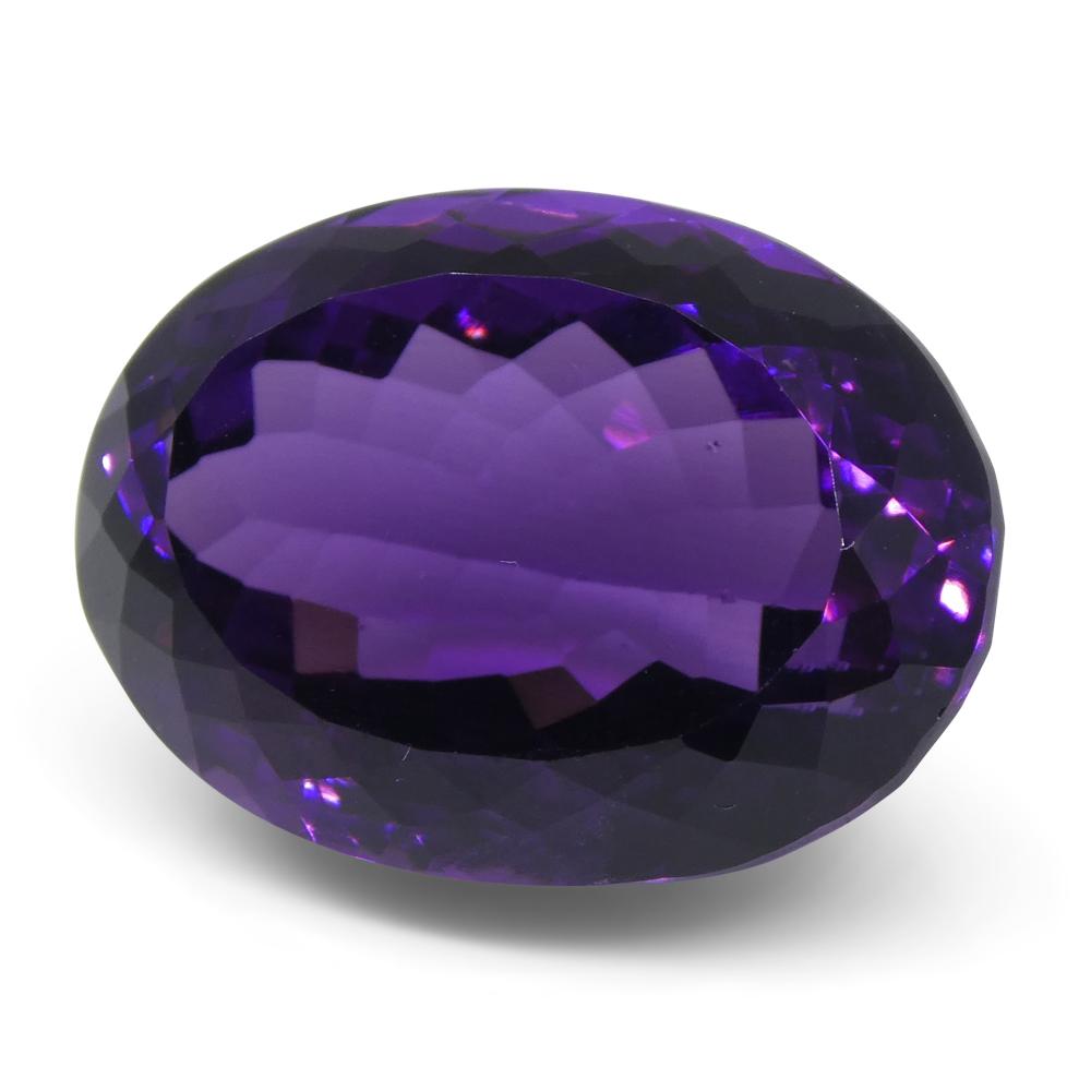 Large 20.72 ct purple Brazilian oval amethyst from SkyJems, unheated Modified Brilliant-cut gemstone showcasing rich violet q