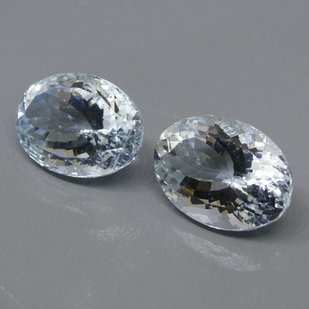 Vivid blue Brazilian aquamarine oval pair, 12.58 carats, premium mixed cut gemstones from SkyJems Canadian gem specialists