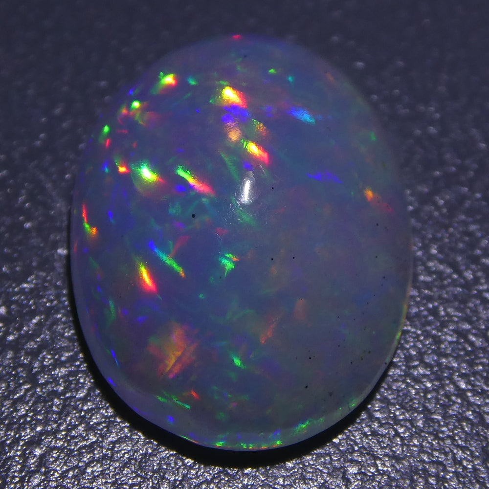 3.01ct Ethiopian Crystal Opal with Vibrant Play of Colour, Oval Cabochon Cut - Premium Gemstone by SkyJems Canada