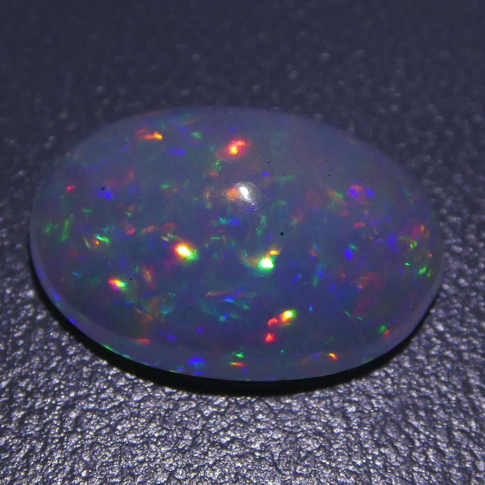 3.01ct Ethiopian Crystal Opal with Vibrant Play of Colour, Oval Cabochon Cut - Premium Gemstone by SkyJems Canada