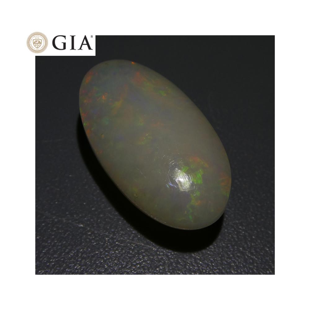 15.54 ct Ethiopian Opal with Vibrant Play of Color, Oval White Gemstone, GIA Certified by SkyJems
