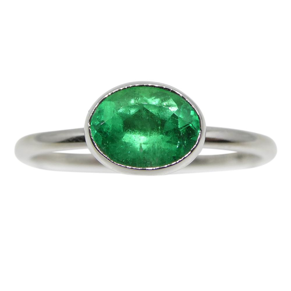 Dainty Colombian emerald oval stacker ring in 10kt white gold, handcrafted by SkyJems Canadian jewellers since 1967