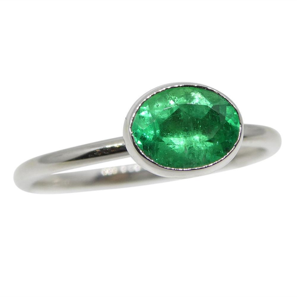 Dainty Colombian emerald oval stacker ring in 10kt white gold, handcrafted by SkyJems Canadian jewellers since 1967