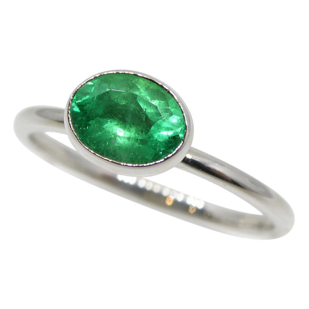 Dainty Colombian emerald stacker ring in 10kt white gold, oval green gemstone, handcrafted by SkyJems Canadian jewellers
