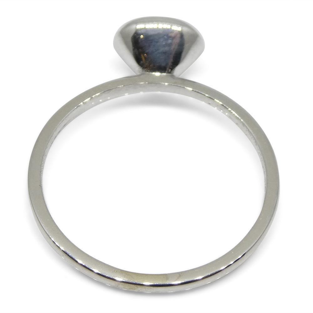 Dainty Colombian emerald stacker ring in 10kt white gold, oval green gemstone, handcrafted by SkyJems Canadian jewellers