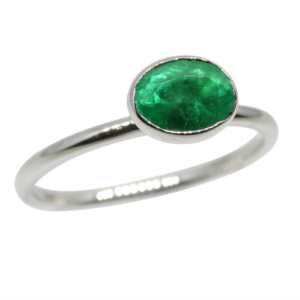 Dainty Colombian emerald stacker ring in 10kt white gold, oval green gemstone, handcrafted by SkyJems Canadian jewellers
