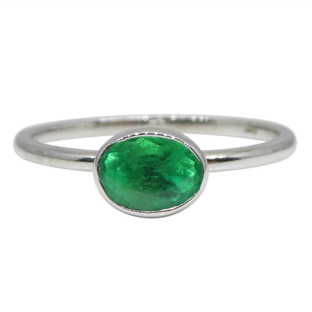 Dainty Colombian emerald oval stacker ring in 10kt white gold, handcrafted by SkyJems Canadian jewellers since 1967