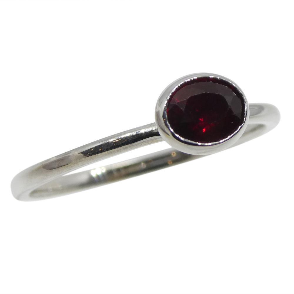 Dainty oval ruby stacker ring in 10kt white gold, Myanmar origin, handcrafted by SkyJems Canadian jewellers