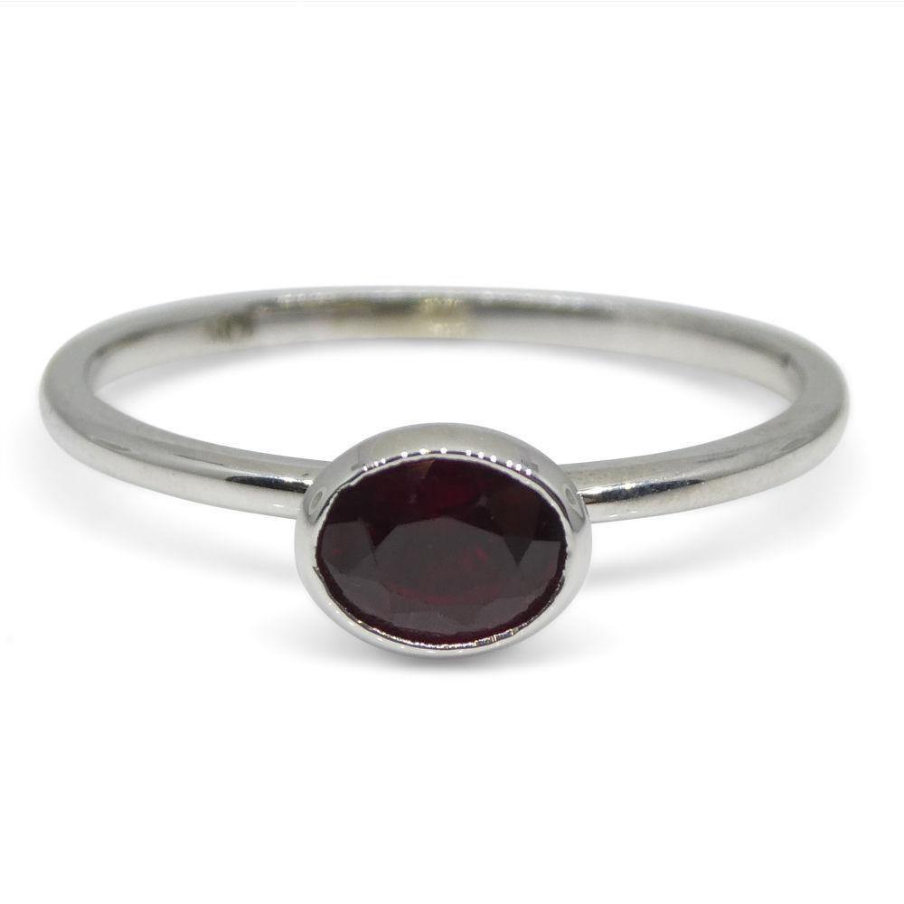 Dainty oval ruby stacker ring in 10kt white gold, Myanmar origin, handcrafted by SkyJems Canadian jewellers