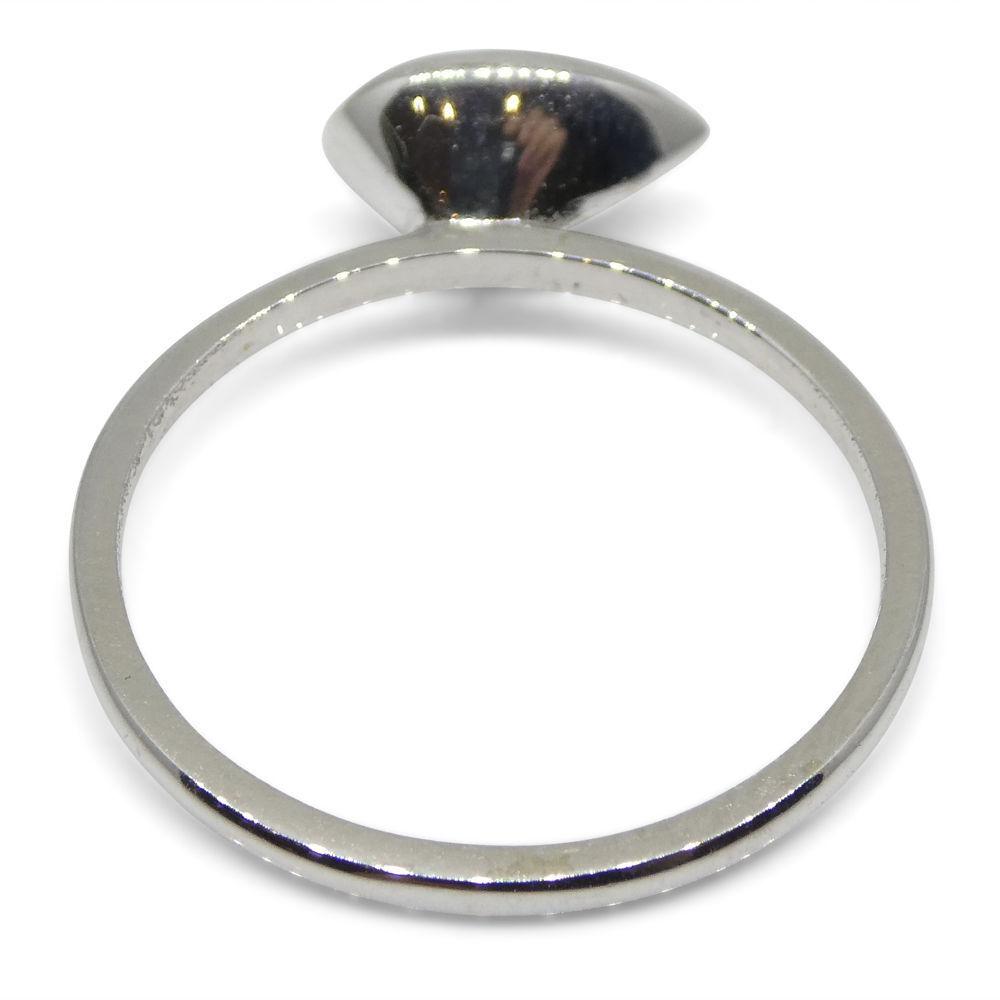 Dainty Colombian emerald pear stacker ring in 10kt white gold, handcrafted by SkyJems Canadian jewellers