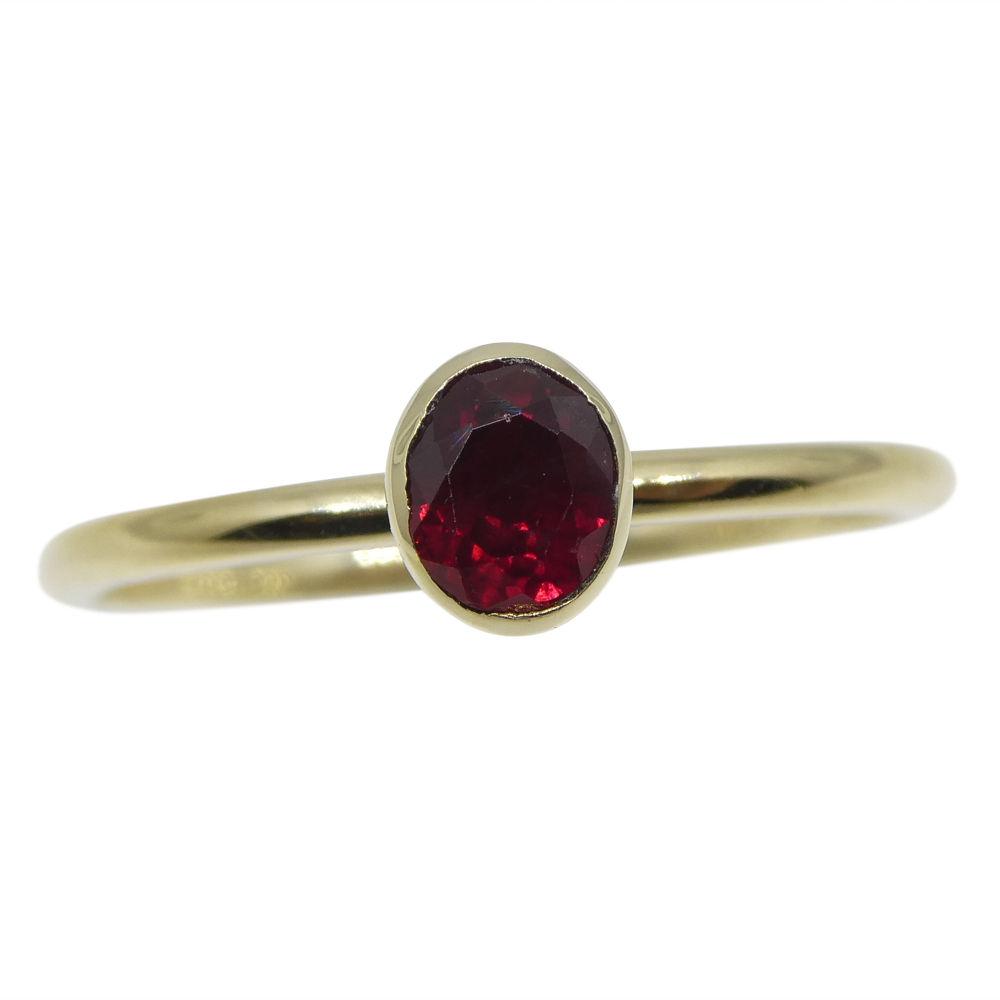 Dainty oval ruby stacker ring in 10kt yellow gold, Myanmar origin, handcrafted by SkyJems Canadian jewellers