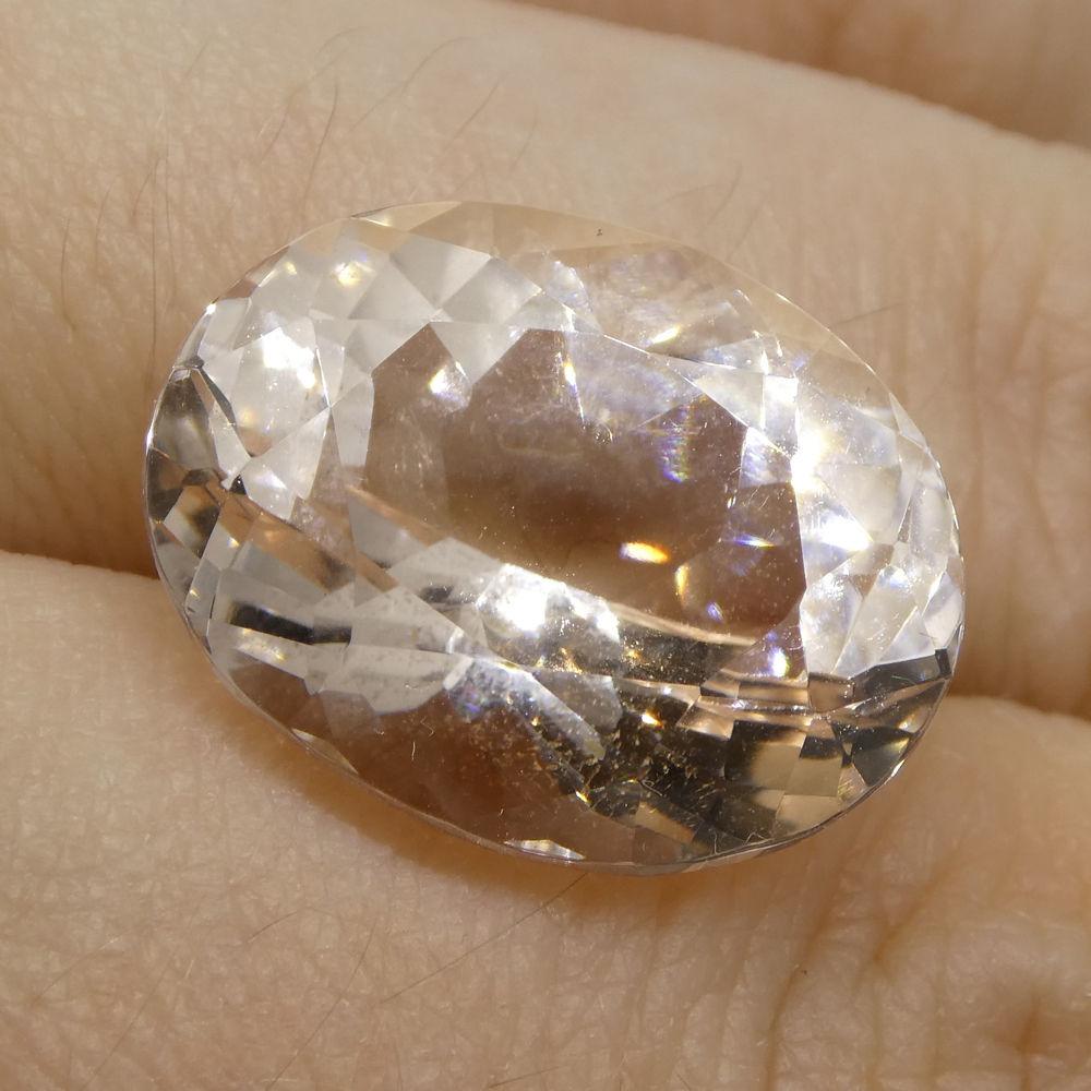 13.69 ct Brazilian Oval Morganite, soft pink to orange-pink beryl gemstone from SkyJems' premium loose stone collection