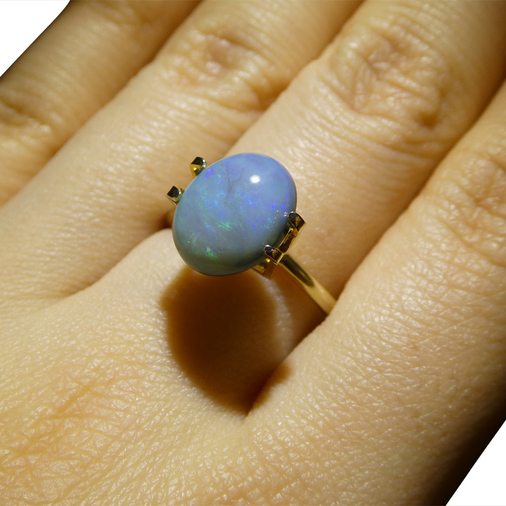 2.37ct Australian Black Opal with vibrant play of color, oval cabochon cut - premium gemstone from SkyJems' curated collectio