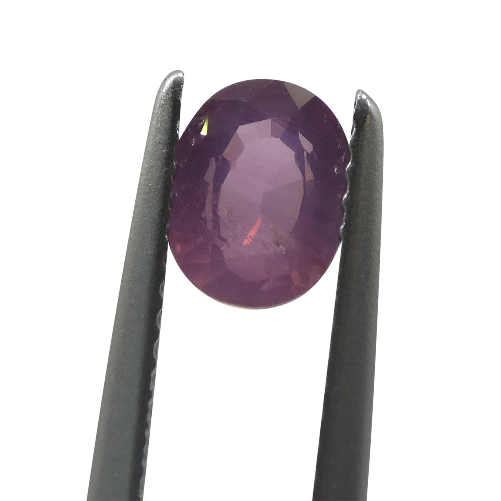 1.17ct Oval Opalescent Orangy Purplish Pink Sapphire from Umba, Tanzania - Skyjems Wholesale Gemstones