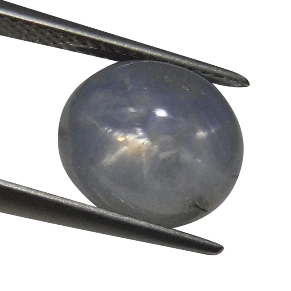 SkyJems 7.02 ct Blue Oval Star Sapphire from Sri Lanka, showcasing rare asterism effect in classic gemstone design