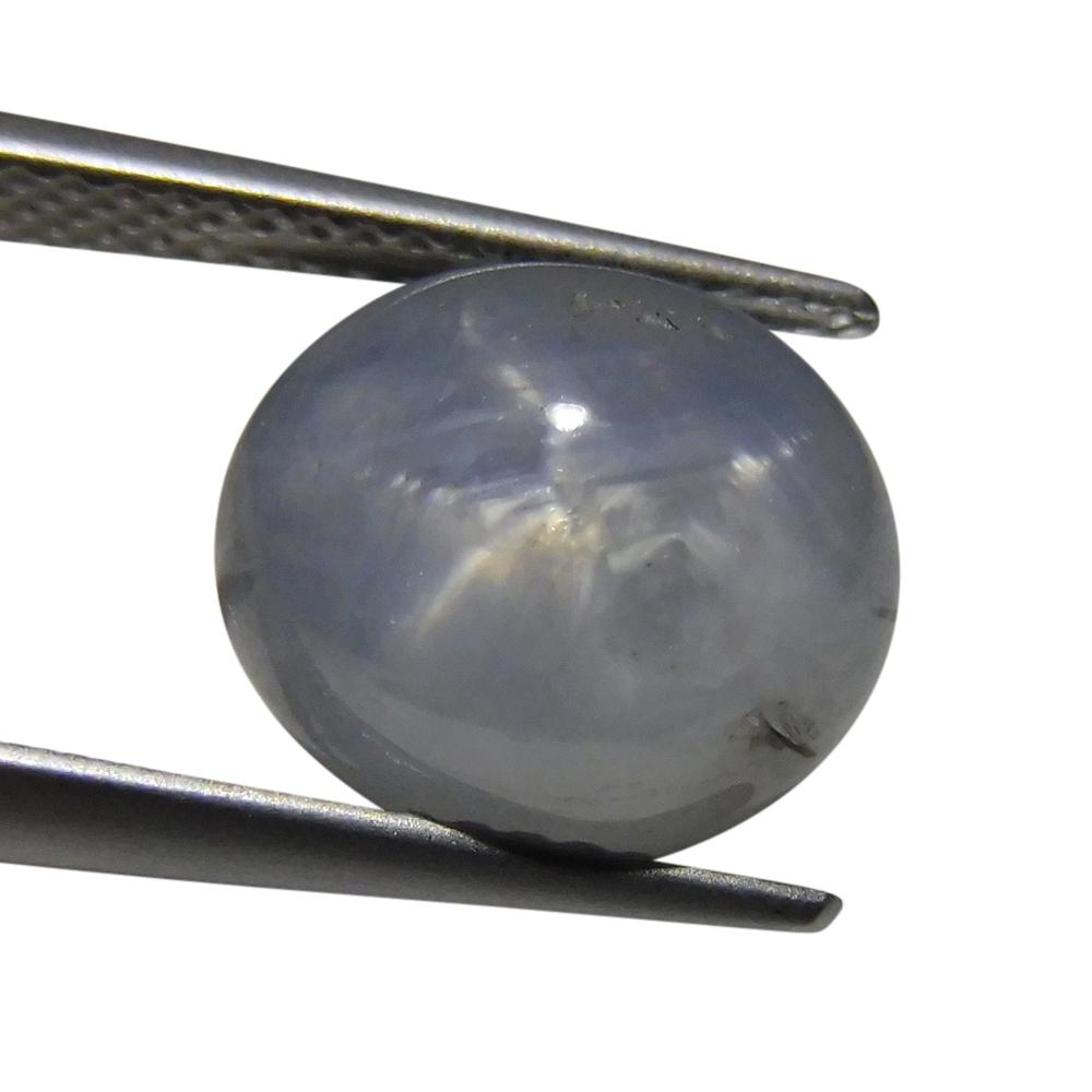 SkyJems 7.67 ct Blue Oval Star Sapphire from Sri Lanka, showcasing rare asterism effect in classic gemstone shape