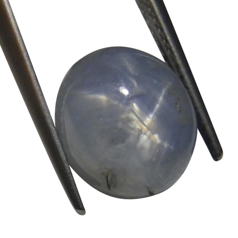 SkyJems 7.67 ct Blue Oval Star Sapphire from Sri Lanka, showcasing rare asterism effect in classic gemstone design