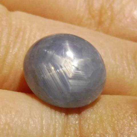 Blue oval star sapphire 6.86 ct from Sri Lanka, showcasing asterism effect, premium gemstone by SkyJems Canadian gem speciali